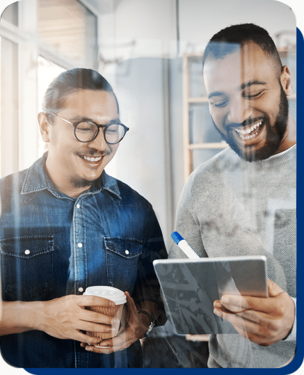 Two employee smile and work on tablet in office