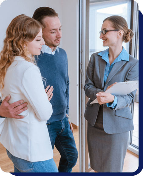 Real estate agent discussing rental details with a couple during property viewing
